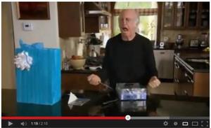 Comedian Larry David is forced to curb his enthusiasm as he  brings in the heavy artillery to open the packaging on his new gadget purchase.